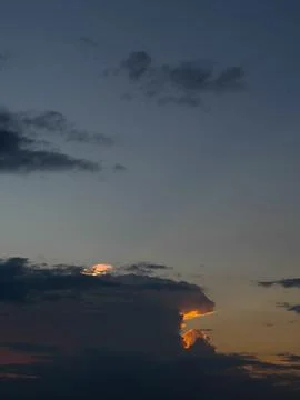 Dramatic Sunset Sky with Illuminated Clouds Stock Photos