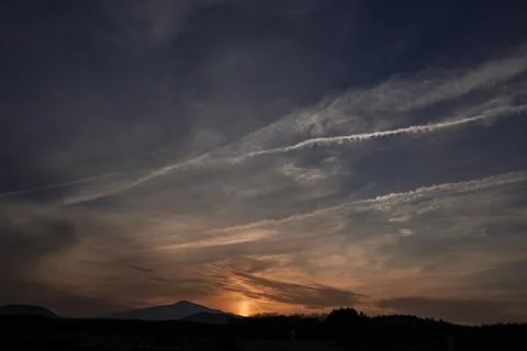Dramatic Sunset Sky with Mountain Silhouette Stock Photos