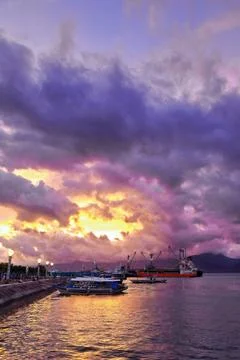 Dramatic sunset sky-oceangoing cargo-tourist balangay boats. P.Princesa-PH Stock Photos