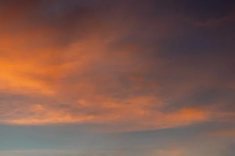 Dramatic Sunset Sky with Orange and Purple Clouds Stock Photos