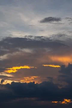 Dramatic Sunset Sky with Orange and Gray Clouds 스톡 사진