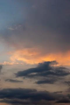 Dramatic Sunset Sky with Orange and Gray Clouds Stock Photos
