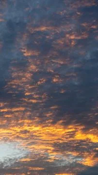 Dramatic Sunset Sky with Orange and Blue Clouds 스톡 사진