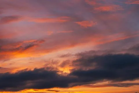 Dramatic Sunset Sky with Orange and Purple Clouds Stock Photos
