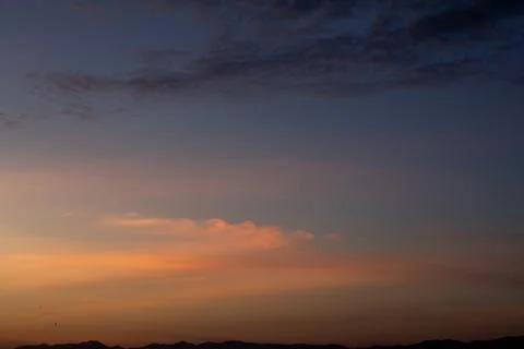 Dramatic Sunset Sky Over Distant Mountains Stock Photos
