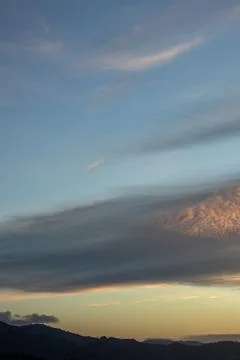 Dramatic Sunset Sky Over Distant Mountains Stock Photos