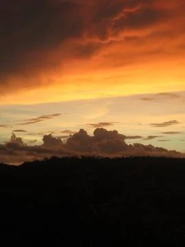 Dramatic Sunset Sky Over Mountain Silhouette Stock Photos