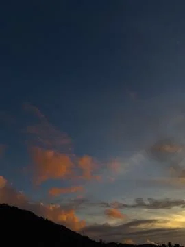 Dramatic Sunset Sky Over Silhouetted Hills Stock Photos