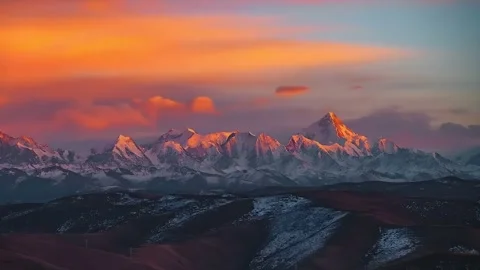 Dramatic Sunset Sky over Snowy Mountain Range Western Sichuan China Stock Footage 338424375