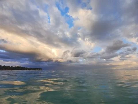 Dramatic Sunset Sky Over Tropical Water Stock Photos