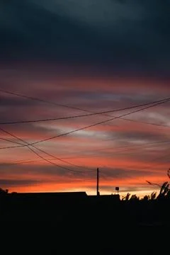 Dramatic Sunset Sky with Power Lines Stock Photos
