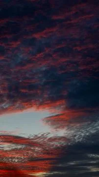 Dramatic Sunset Sky with Red and Blue Clouds Stock Photos