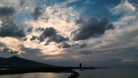 Dramatic Sunset Sky with Rolling Clouds Over City Silhouette Stock Footage 324911867