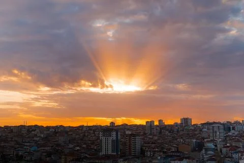Dramatic sunset sky with the setting sun and clouds over the city, Istanbul 写真素材