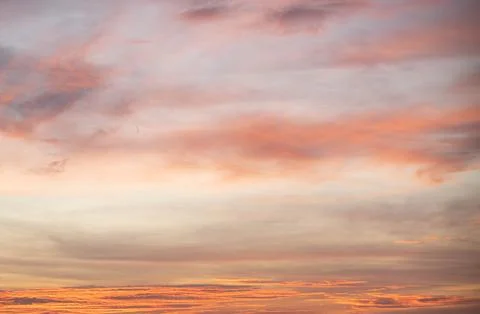 Dramatic sunset sky in soft and bright orange Pastel tone. sunset backgroun.. Stock Photos