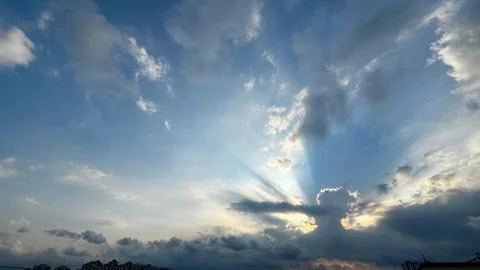 Dramatic sunset sky with sunbeams Fotos Stock