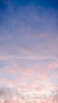 Dramatic sunset sky with textured clouds glowing in pink and orange colors .. Photos