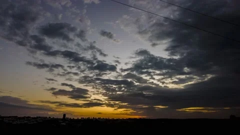 Dramatic sunset in the Sky through cumulus storm clouds, Stock Footage 194388967