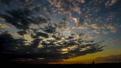 Dramatic sunset in the Sky through cumulus storm clouds Stock Footage 197583655
