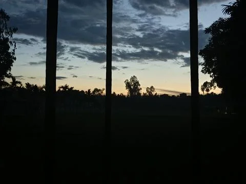 Dramatic sunset sky through vertical window panes Stock Photos