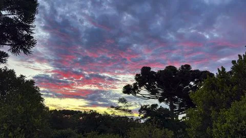 Dramatic sunset sky with vibrant clouds in pink, dusk, frame, frame the scene Stock Photos