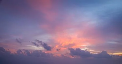 Dramatic sunset sky with vibrant clouds creating a stunning evening backdrop Stock Photos