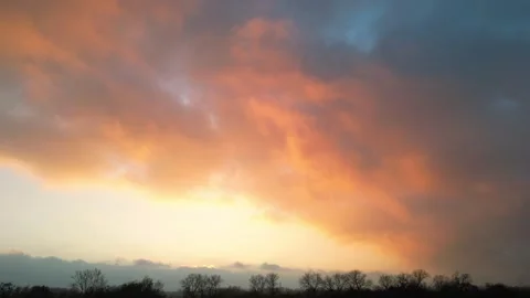 Dramatic sunset sky with vibrant orange and blue hues, gradual colors Stock Footage 323614694