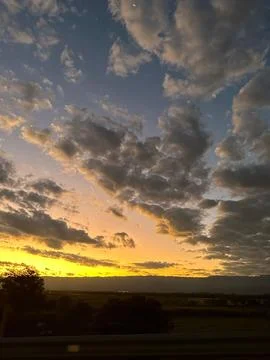 Dramatic sunset skyline with clouds Stock Photos