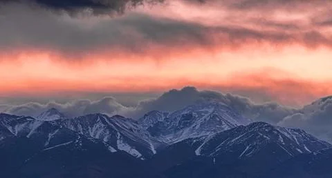 Dramatic sunset in the snow-covered Andes Mountains. Calingasta, San Juan Stock Photos