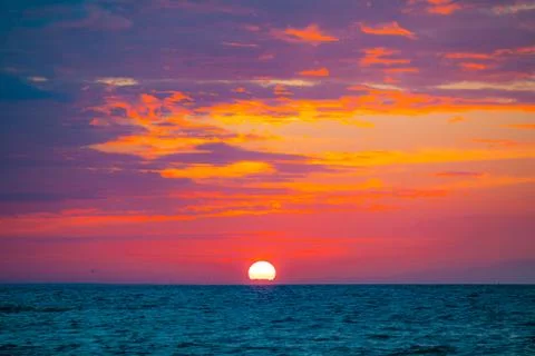 Dramatic sunset at summer over Baltic sea Stock Photos