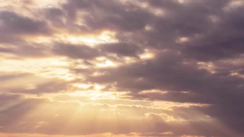 Dramatic sunset.  Sun rays emerge through the clouds. Stock Footage 254236143