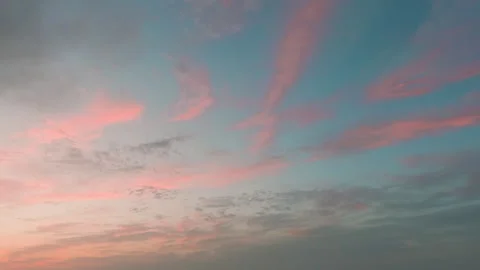 Dramatic sunset timelapse with fast-moving clouds painting a vivid sky Stock Footage 344034131
