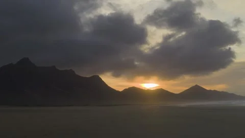 Dramatic sunset timelapse over Cofete Beach with moving clouds and mountains 스톡 동영상 331219091
