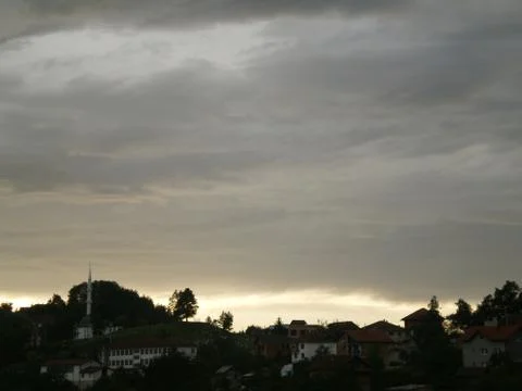 Dramatic sunset under thick cloud Stock Photos