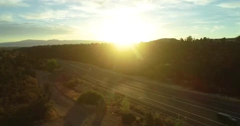 Dramatic sunset view of busy highway in rural Arizona town Stock Footage 131467959