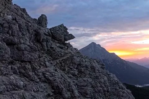 Dramatic Sunset View of High Mountain Ridge and Rocky Peak on Monte Pelmo Trail Stock Photos