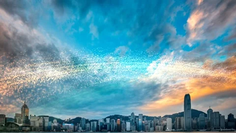 Dramatic sunset view of Hong Kong Victoria Harbor with a sparkling particle sky Stock Footage 345058338