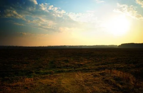 Dramatic sunset on wilderness field background 스톡 사진