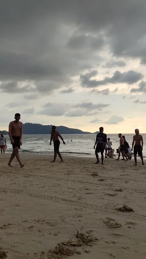 Dramatic sunsets and few tourists on the beach. Stock Footage 309436978