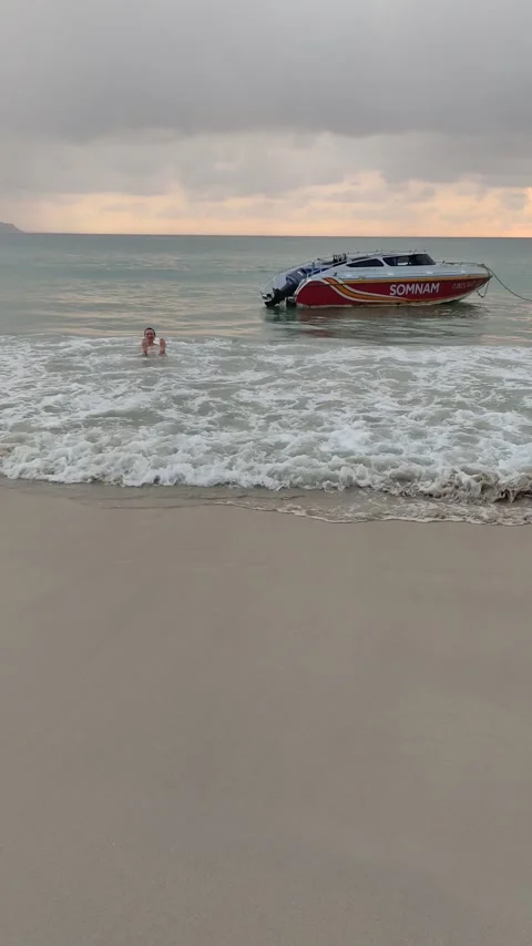 Dramatic sunsets and few tourists on the beach. Stock Footage 309436981