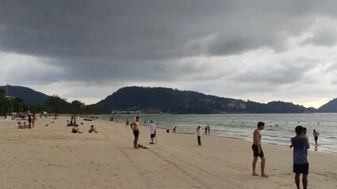 Dramatic sunsets and few tourists on the beach. Stock Footage 309436985