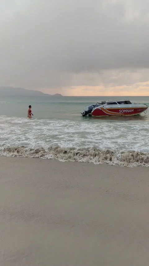Dramatic sunsets and few tourists on the beach. Stock Footage 309437029