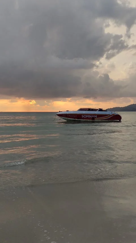 Dramatic sunsets and few tourists on the beach. Stock Footage 309437050