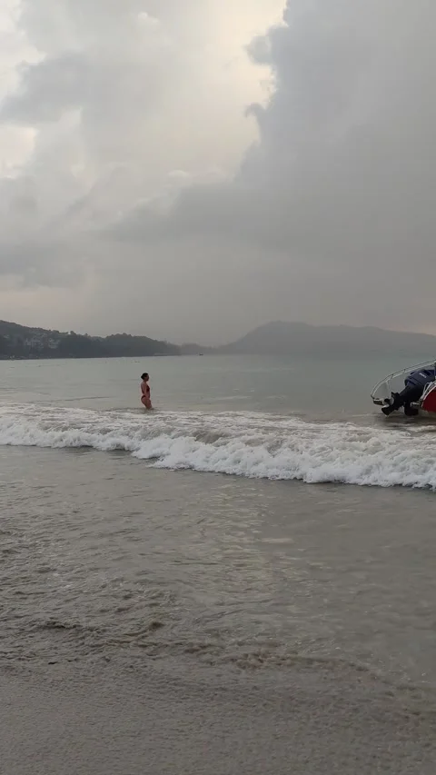 Dramatic sunsets and few tourists on the beach. Stock Footage 309437075