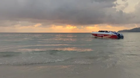 Dramatic sunsets and few tourists on the beach. Stock Footage 309437080