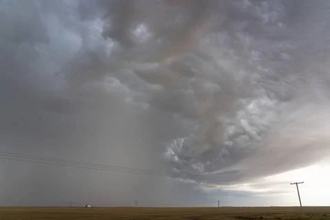 Dramatic supercell storm clouds forming over the plains Imminent supercell... Stock Photos