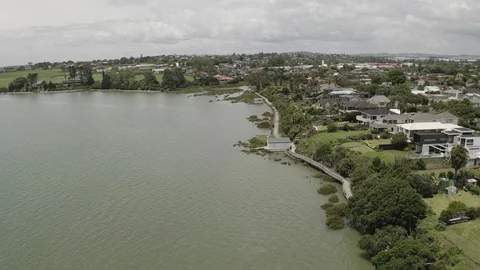 Dramatic sweep of coastal walkway overhead swamp river 4K Stock Footage 110967607