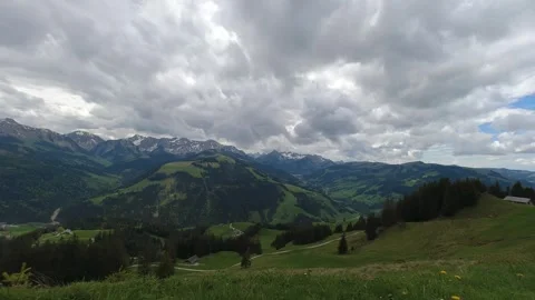 Dramatic Swiss mountain landscape with moving clouds, cinematic timelapse Stock Footage 275889078