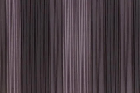 A dramatic textured background with vertical lines in shades of purple 写真素材