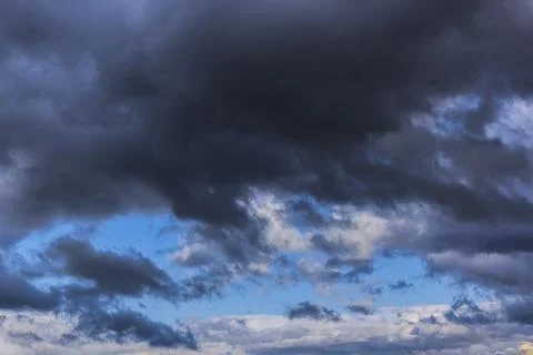 Dramatic thunderstorm clouds background at blue sky Stock Photos